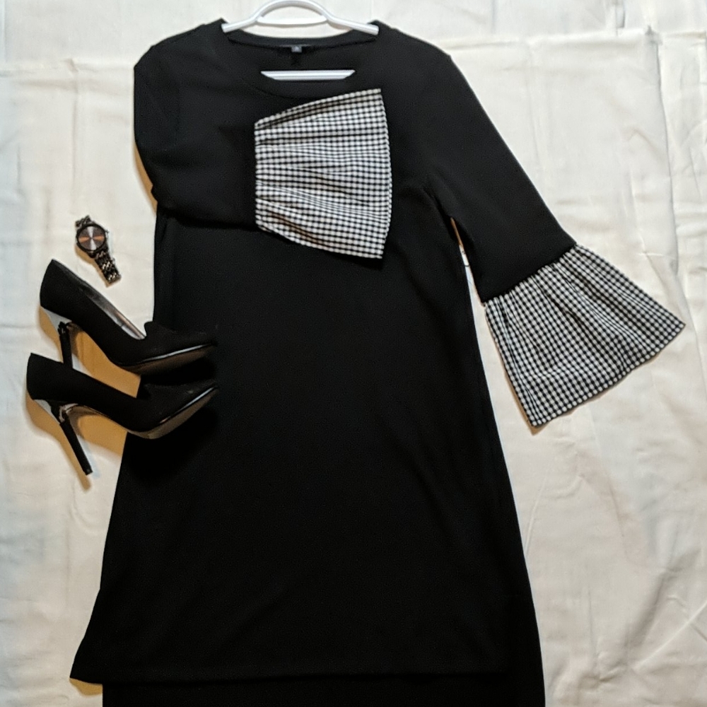 Black dress with flared, checkered sleeves